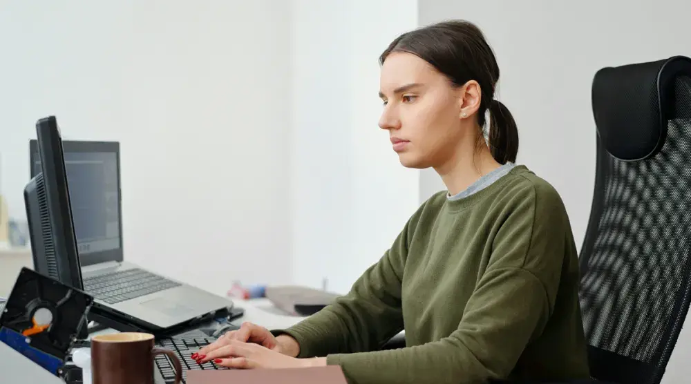 A woman searches online for the name she wants to use for her new business.