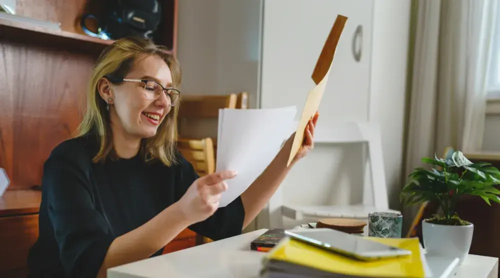 An immigrant to the United States gathers her paperwork for becoming a U.S. citizen.