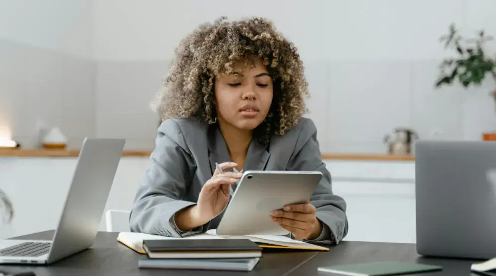 A Delaware business owner uses a tablet to file her business' annual report.