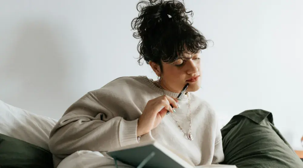 An Ohio business owner lounges in bed as she reviews her LLC's operating agreement.