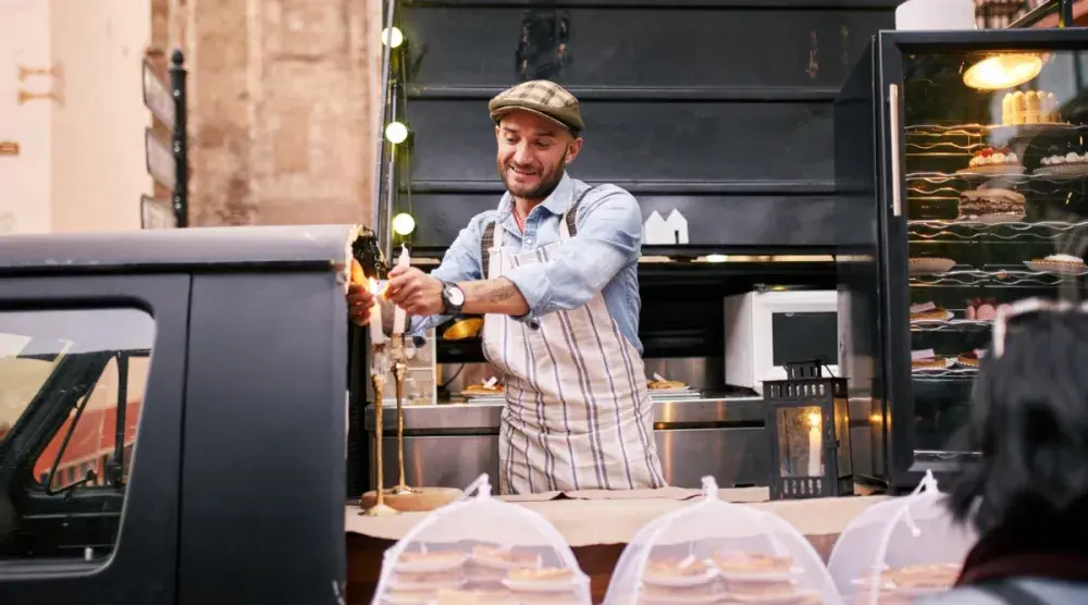 food truck owners prepares meals for customers