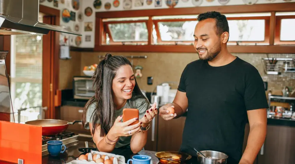 engaged couple happily discussing their prenuptial agreement