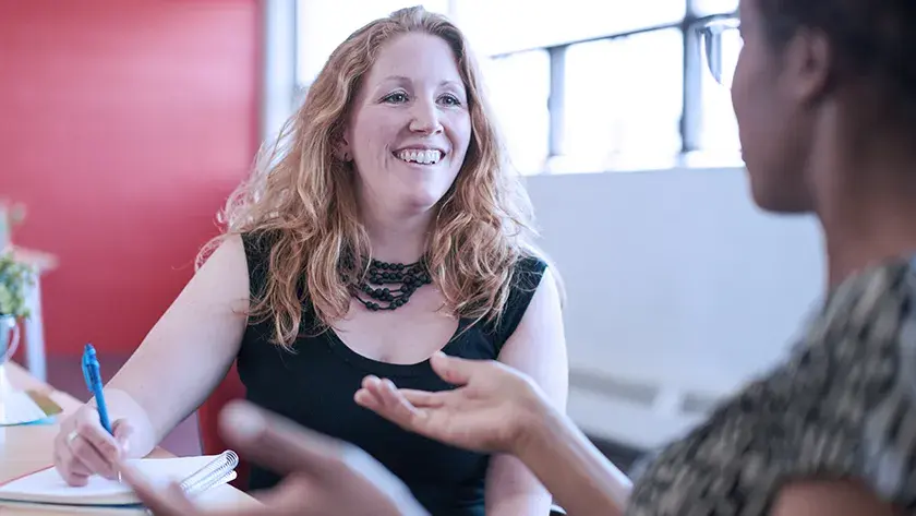 happy woman talking in a meeting 