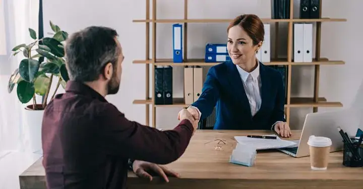 man shaking hands with his trademark attorney 