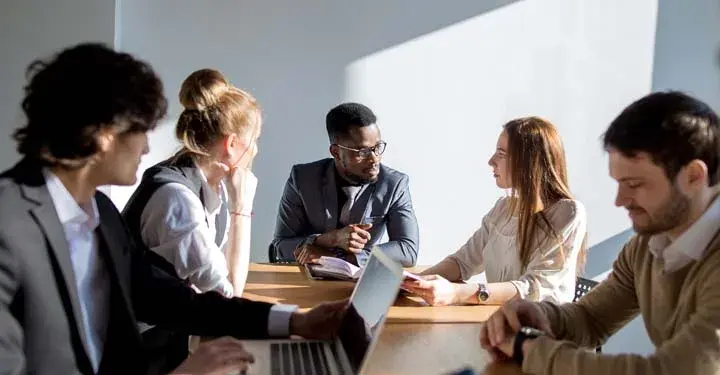 Business people sitting around a table