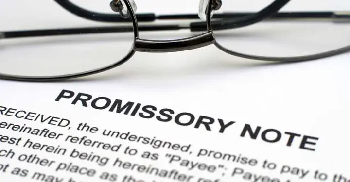 Wire glasses on promissory note document