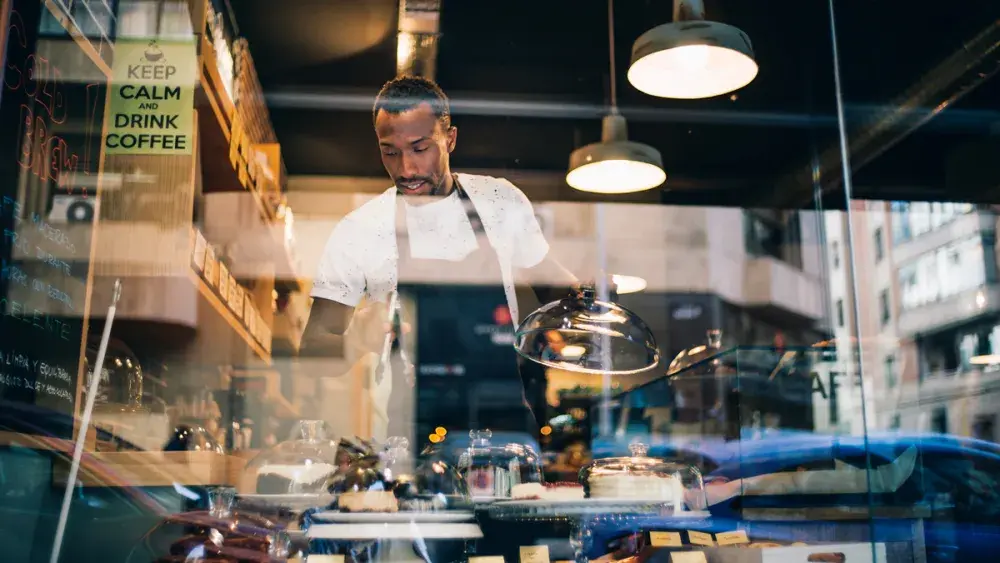 The owner of a new bakery checks inventory. Small business owners cannot reserve a name prior to registering their LLCs in Florida. 