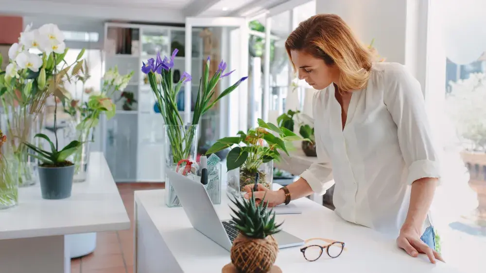 The owner of a floral shop goes over her documents before filing for her LLC with the Illinois Secretary of State.