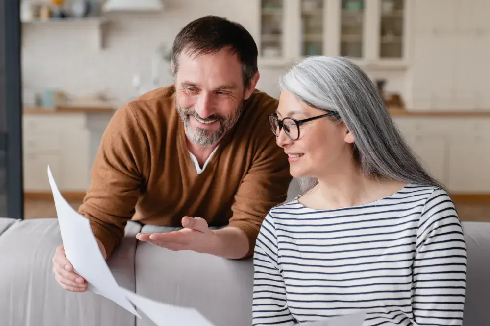 There are four major types of trusts: Here a man and a woman read documents related to their trust.