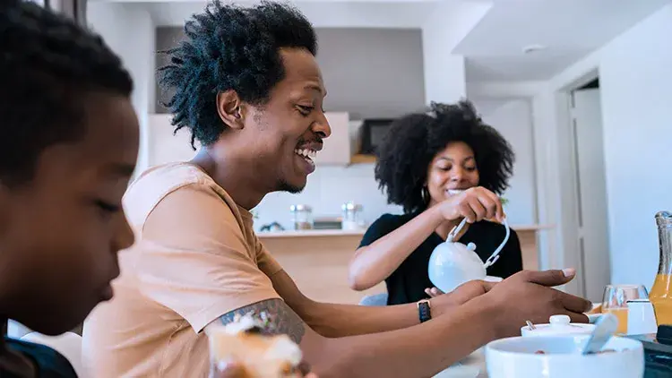 family-eating-breakfast-smiling