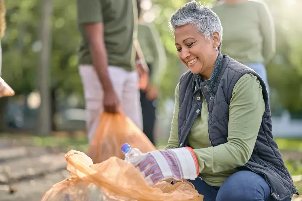 A woman collects recyclables in a park for her recycling business in Texas, where the process of establishing an LLC is relatively simple compared to forming a corporation.