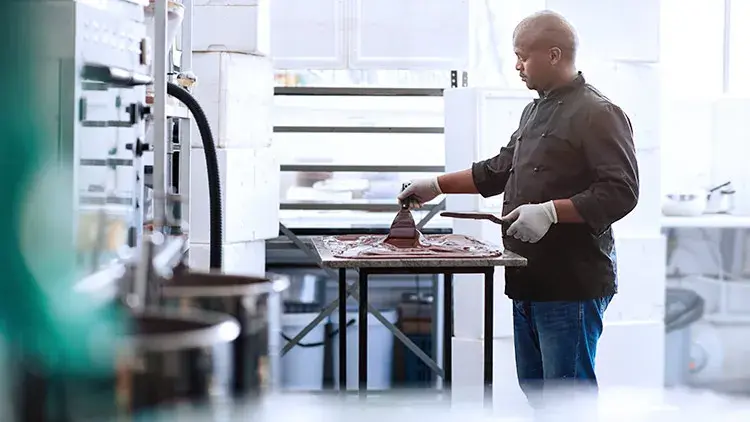 Man in restaurant making chocolate