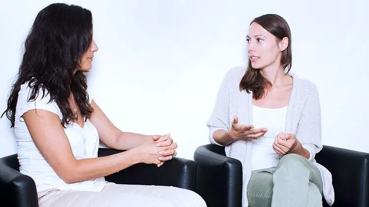 Two women having a serious discussion