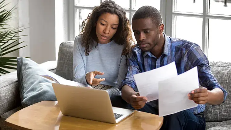 Woman and man have discussion over paperwork