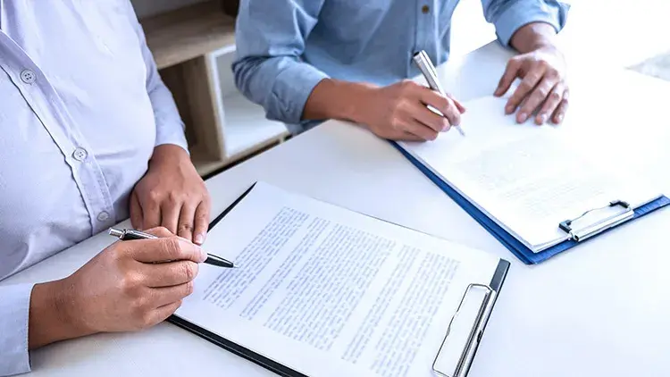 woman-man-signing-documents