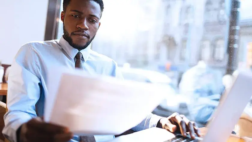 Businessman looking over documents