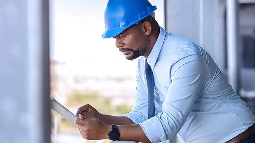 construction-businessman-looking-at-ipad