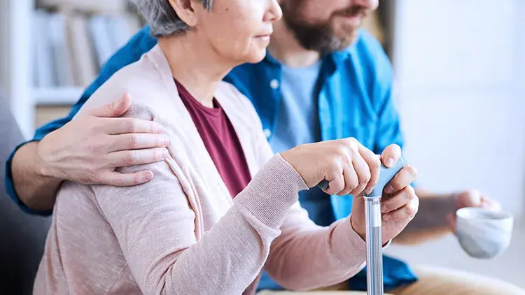 Elderly mother and son sitting together