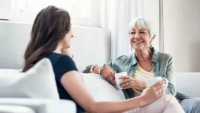 inheritance-etiquette-hero mother and daughter talking on the sofa 