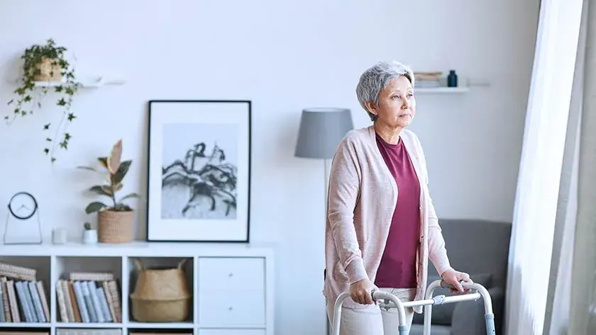 senior-woman-using-walker-in-home