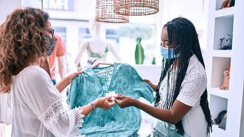 shop-seller-taking-payment-for-blouse