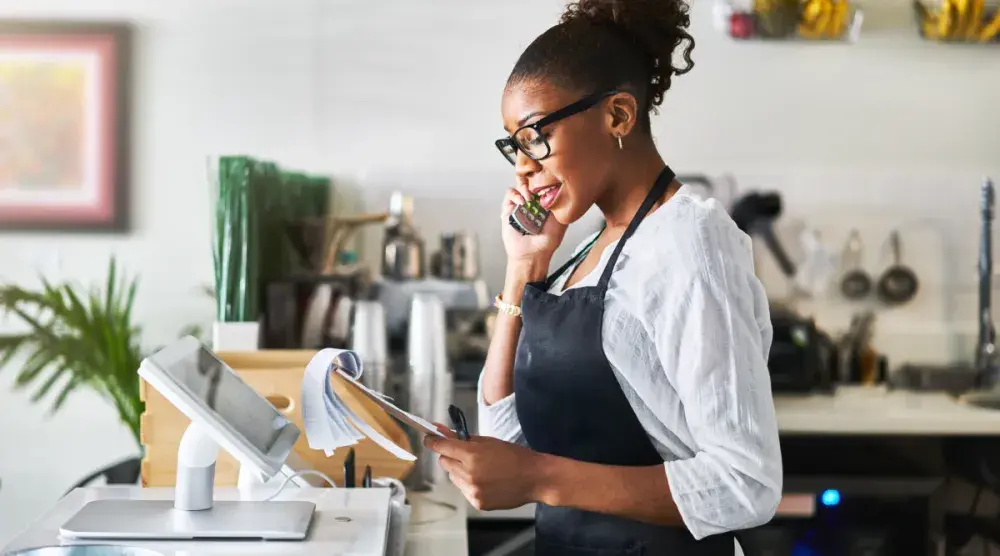 black woman talking on the phone about hiring a patent attorney