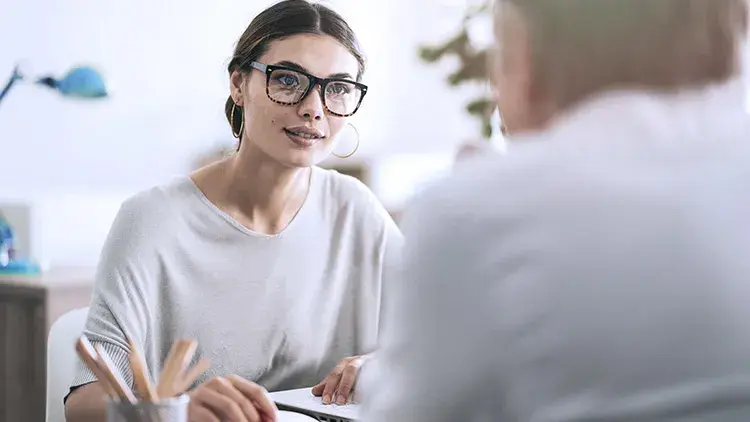 Woman consults client in office