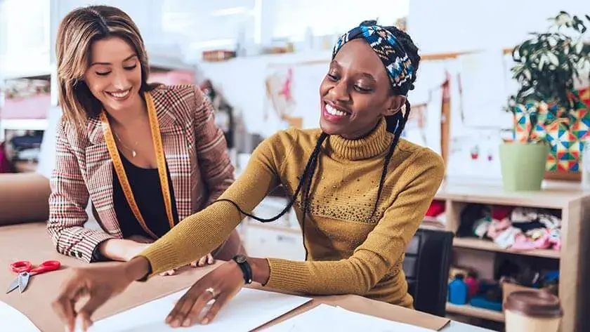 woman-discussing-business-fashion-industry meausring things in the studio