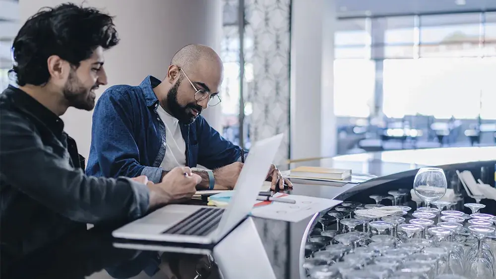 2 men having a business meeting in a restaurant 