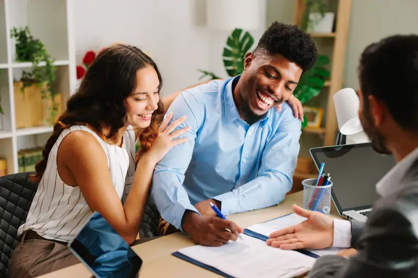 An engaged woman and man in Texas meet with an attorney to draft their prenup