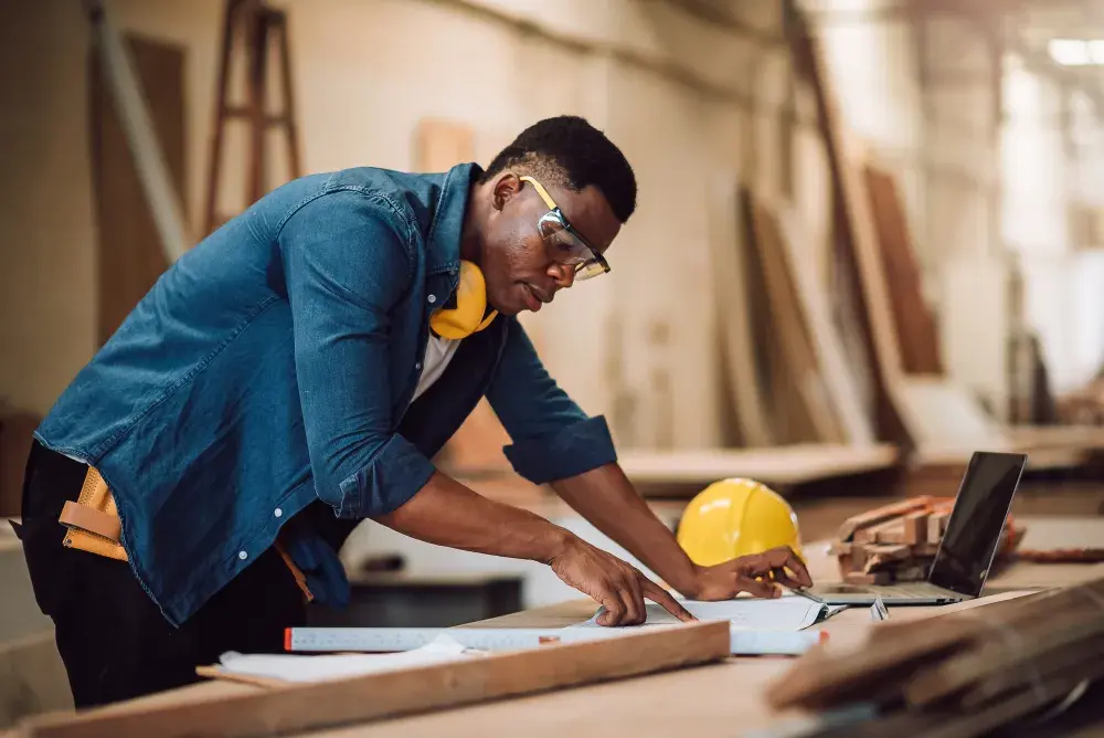 A contractor looks at architectural plans