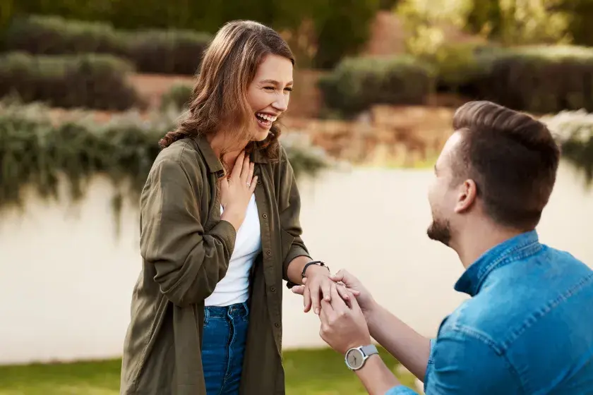 A woman looks joyful as her boyfriend gets on one knee and proposes. An Arizona prenuptial agreement must adhere to state laws to be valid and enforceable. 