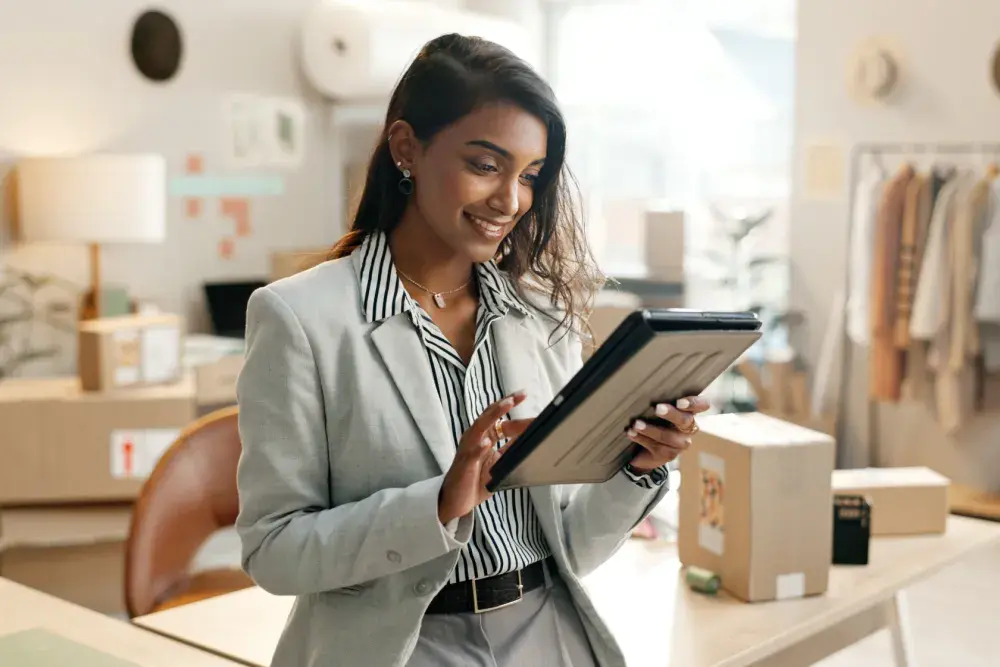 At a small business in Texas, a woman reads about forming an LLC there. The basic cost to form an LLC in Texas is $300.