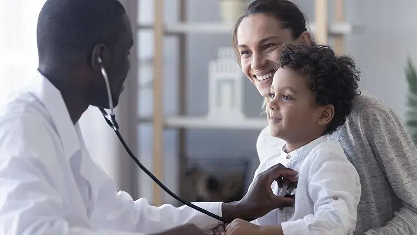 mom taking son to the doctor