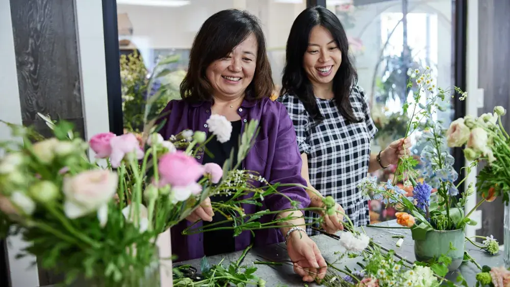 A woman and her daughter work in their family <a href=