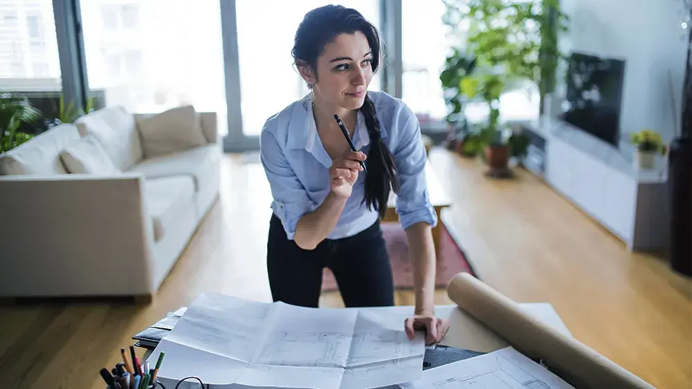 woman going over paperwork in her home office