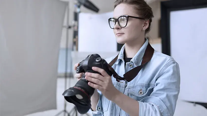 woman taking pictures in a photo studio